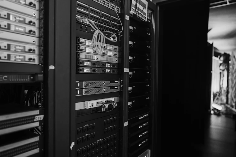 Racks of network hardware in a data centre